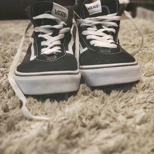Black and white Vans high top